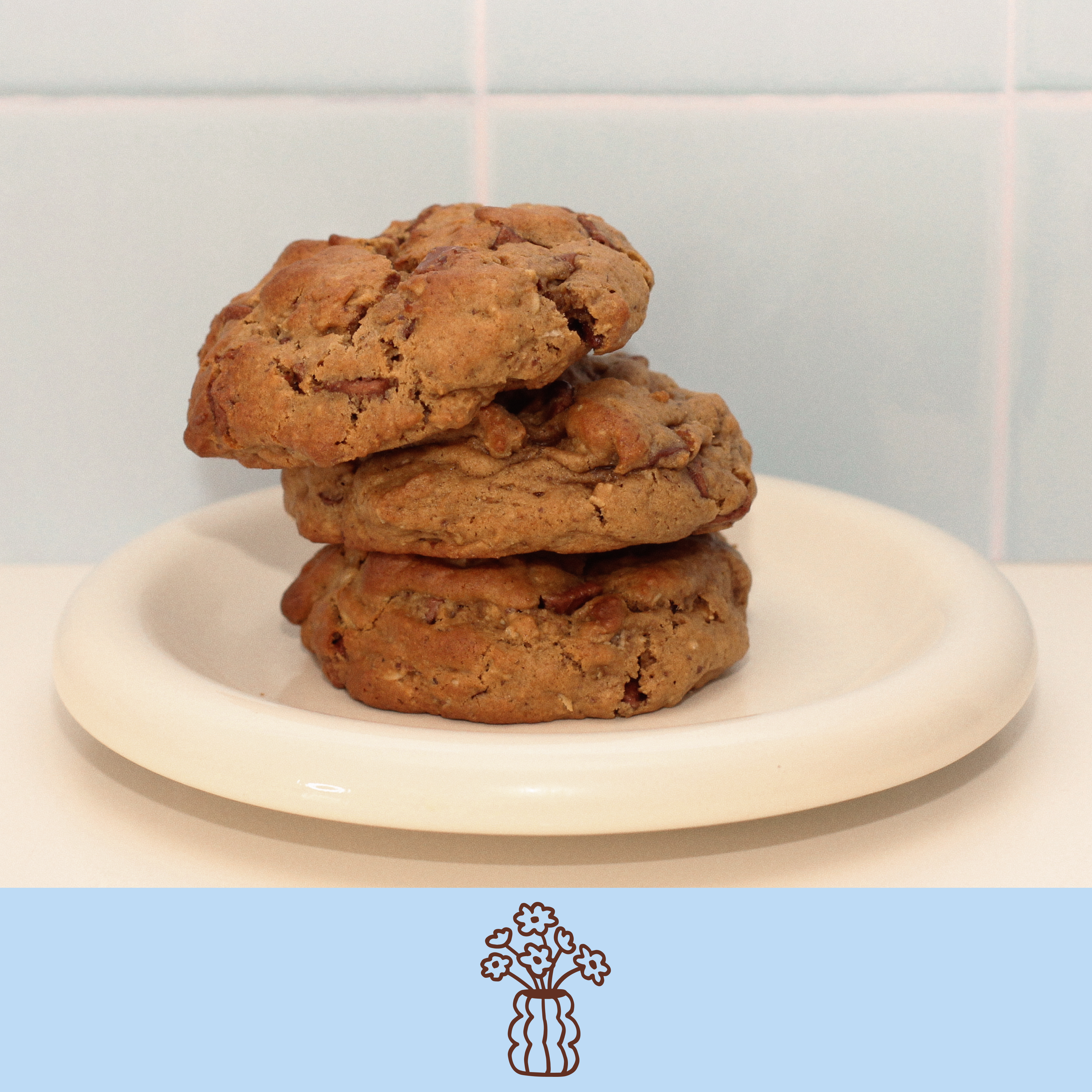 Oatmeal chocolate chip lactation cookie on a white ceramic plate