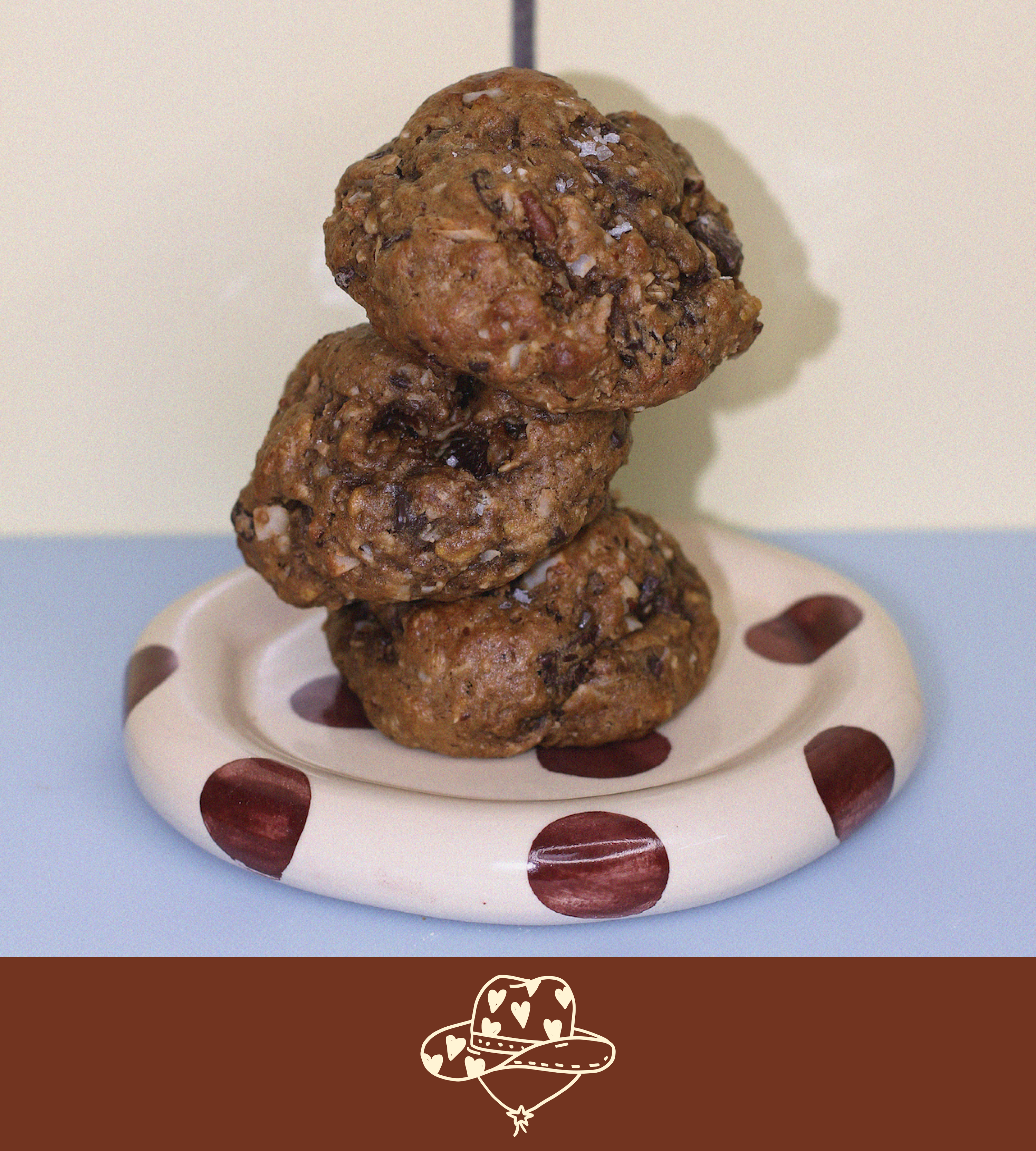 Stack of cowgirl lactation cookies on a polka dot plate with a plain background