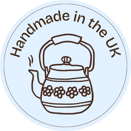 Sticker that says handmade in the UK with an illustrated teapot and small flowers
