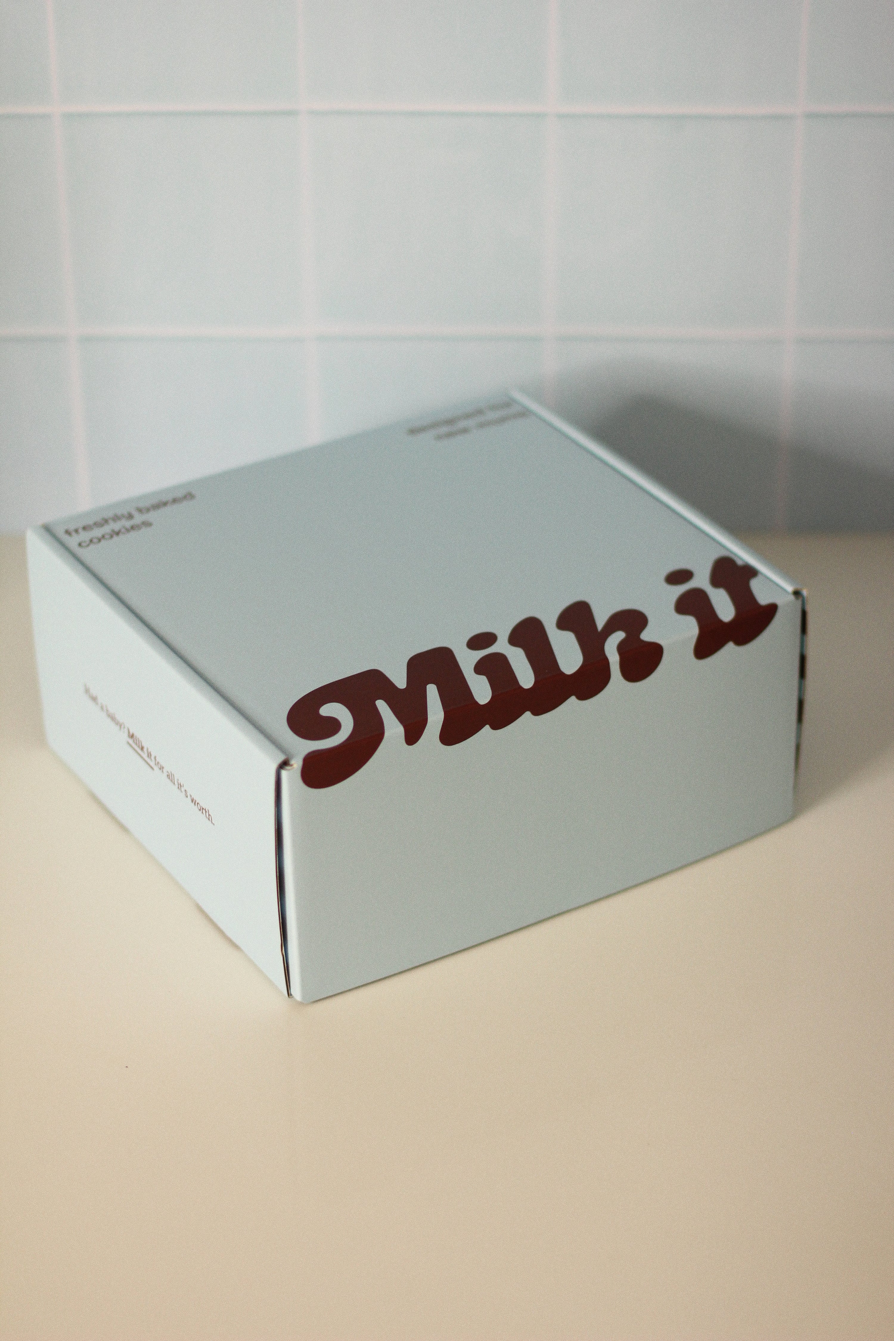 Milk it lactation cookies in a box that says Milk it.  Breastfeeding snacks for new mums made with oats, flaxseed, and brewers yeast