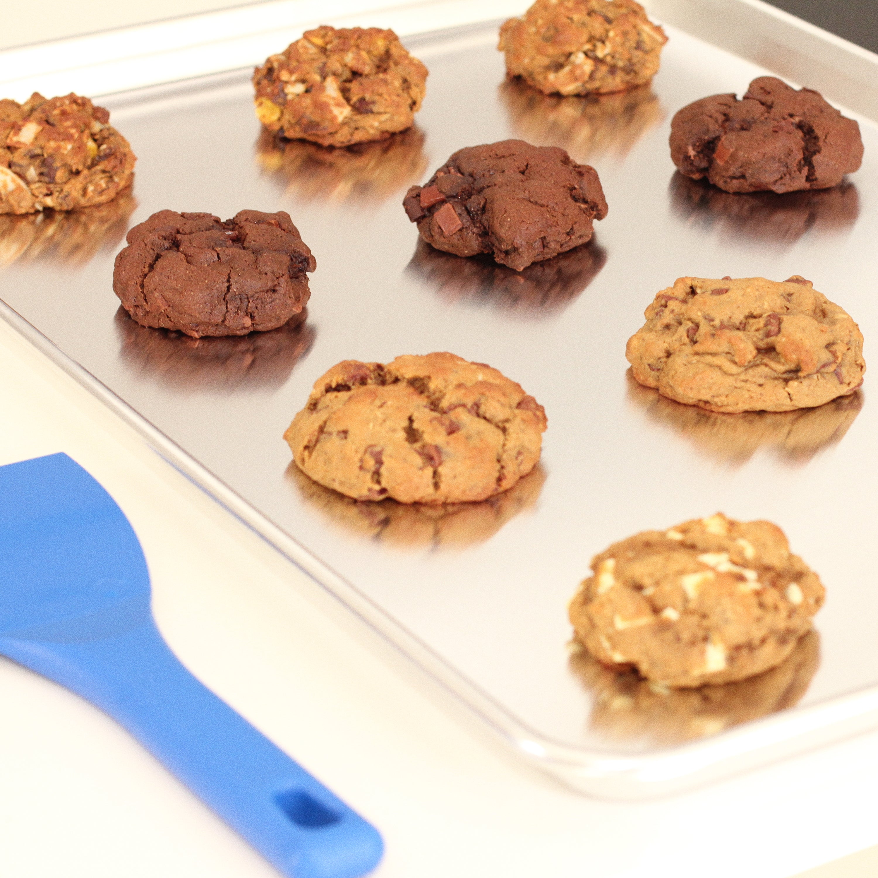 Close-up of Milk it lactation cookies on a baking tray  - breastfeeding snack made with oats, flaxseed, and brewer’s yeast