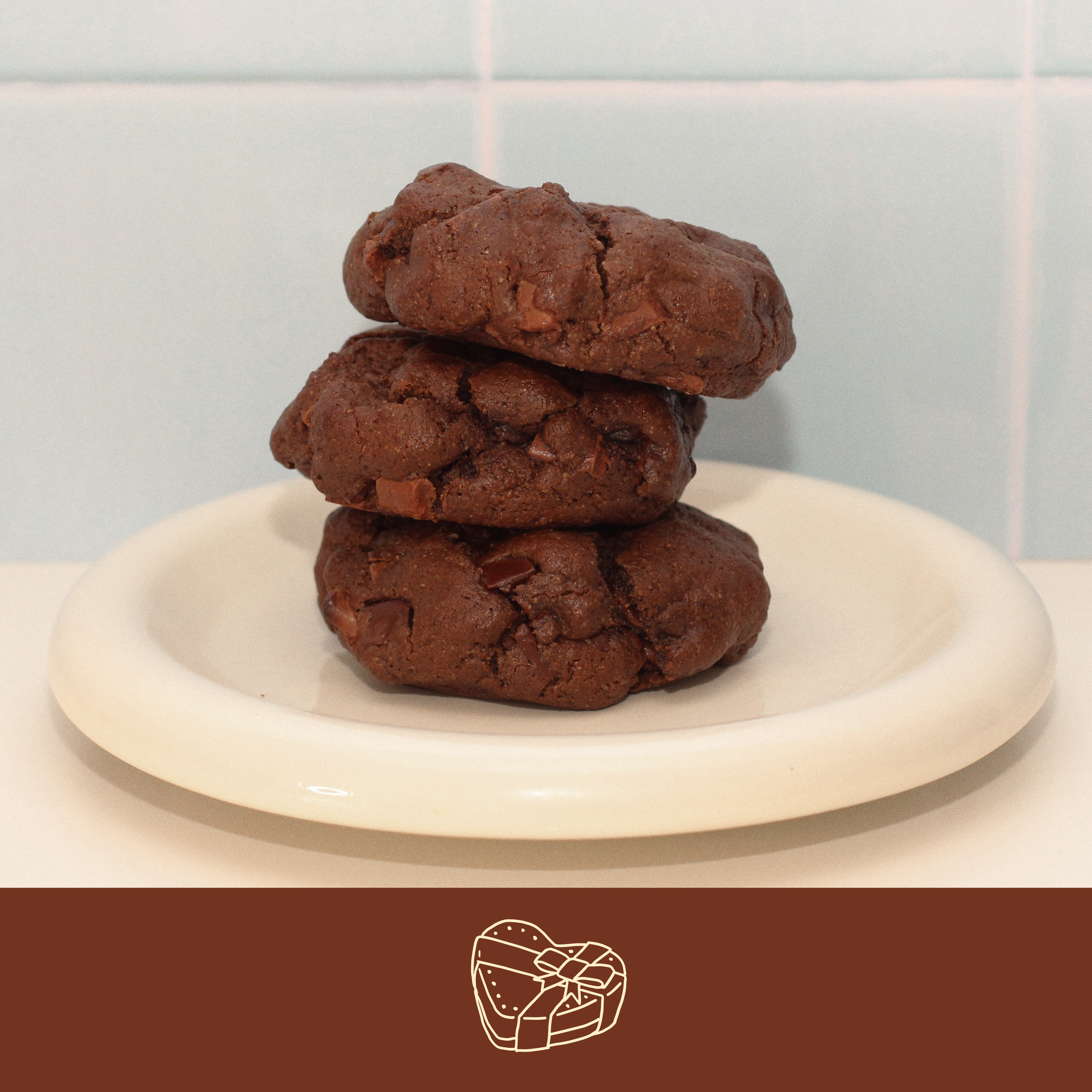 Triple chocolate lactation cookie on a white plate – rich in cocoa and nutrients to support milk supply