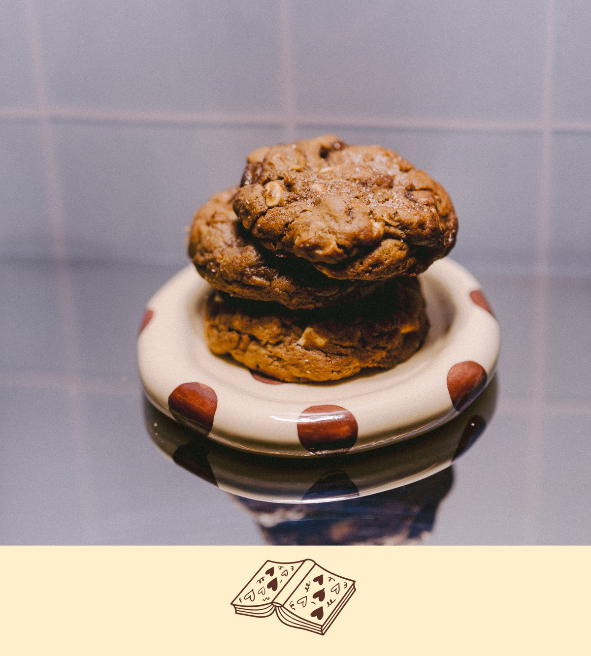 Stack of gluten-free lactation cookies on a polka dot plate with a plain background